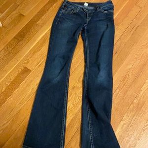 vintage dark wash low waisted jeans